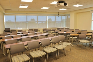 Configured for classroom style, Room 218 accommodates up to 30 guests